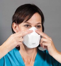 Step Six for donning 3M Aura Health Care Particulate Respirator and Surgical Mask 1870+
