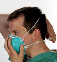 Step four of Donning Instructions for 3M Health Care Particulate Respirator and Surgical Mask, 1860/1860S, N95