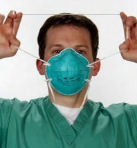 Step two of Removing Instructions for 3M Health Care Particulate Respirator and Surgical Mask, 1860/1860S, N95