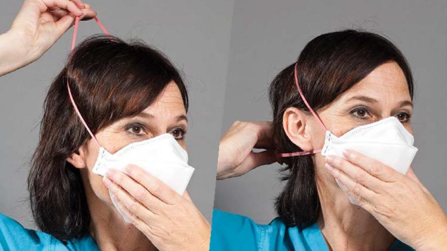 Step four for donning 3M Aura Health Care Particulate Respirator and Surgical Mask 1870+